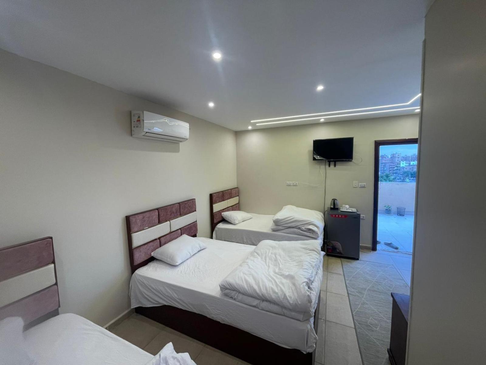 Sami Holiday Inn - Pyramids View Rooftop Al Kawm al Akhdar ภายนอก รูปภาพ